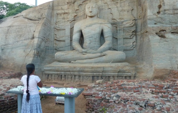 The Buddha seated image, which depicts the Zen sitting and a  woman who prays.